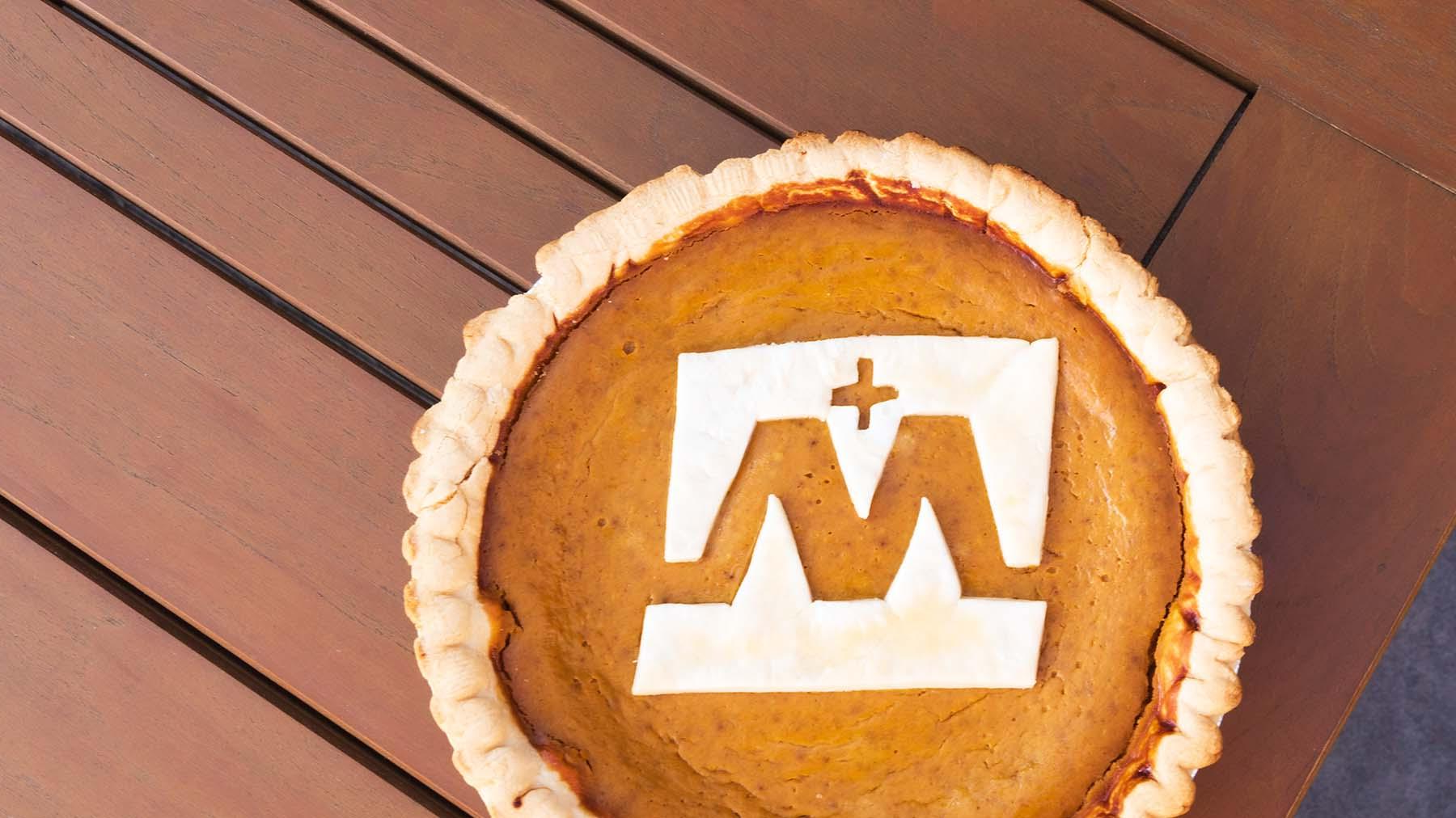 A Pumpkin Pie with the Mary Logo.