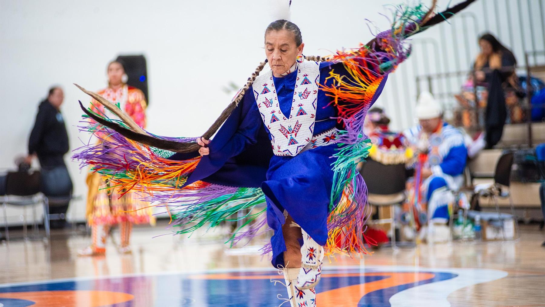 A native American doing a traditional dance.